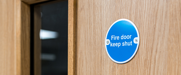 A close up of a wooden fire door